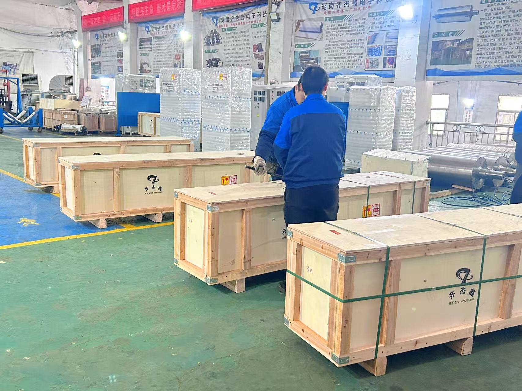 Four coated iron electromagnetic heating rollers are being shipped by a dedicated vehicle